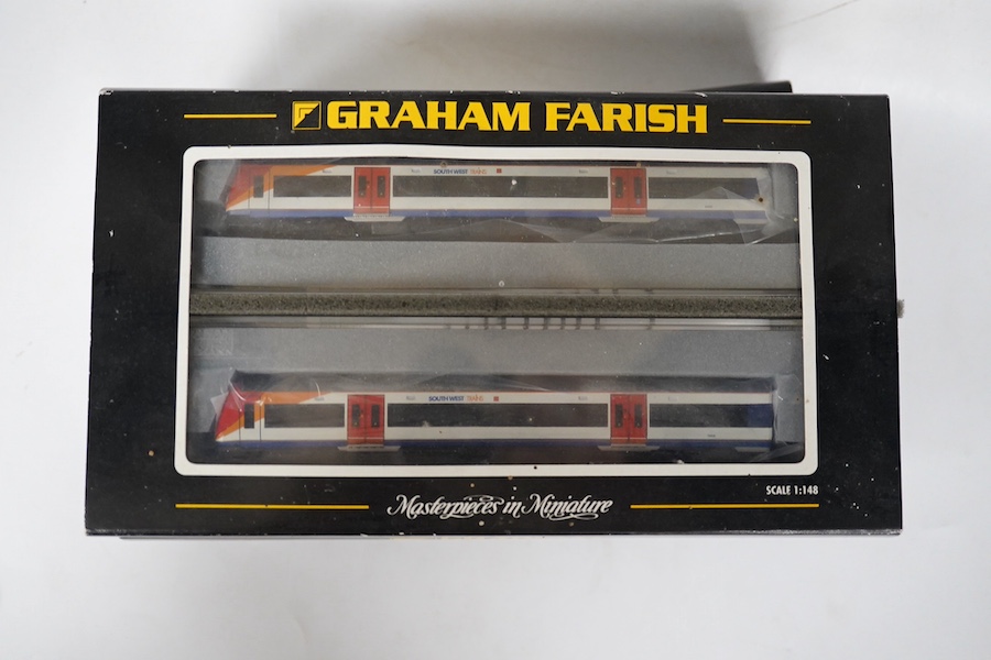 Three boxed Graham Farish N gauge railway DMU train packs; a South West Trains 170/4 2-car DMU (371-427), a Midland Mainline 170/1 Turbostar 2-car DMU (371-425), and a Central Trains Turbostar 170/5 2-car DMU (371-426).